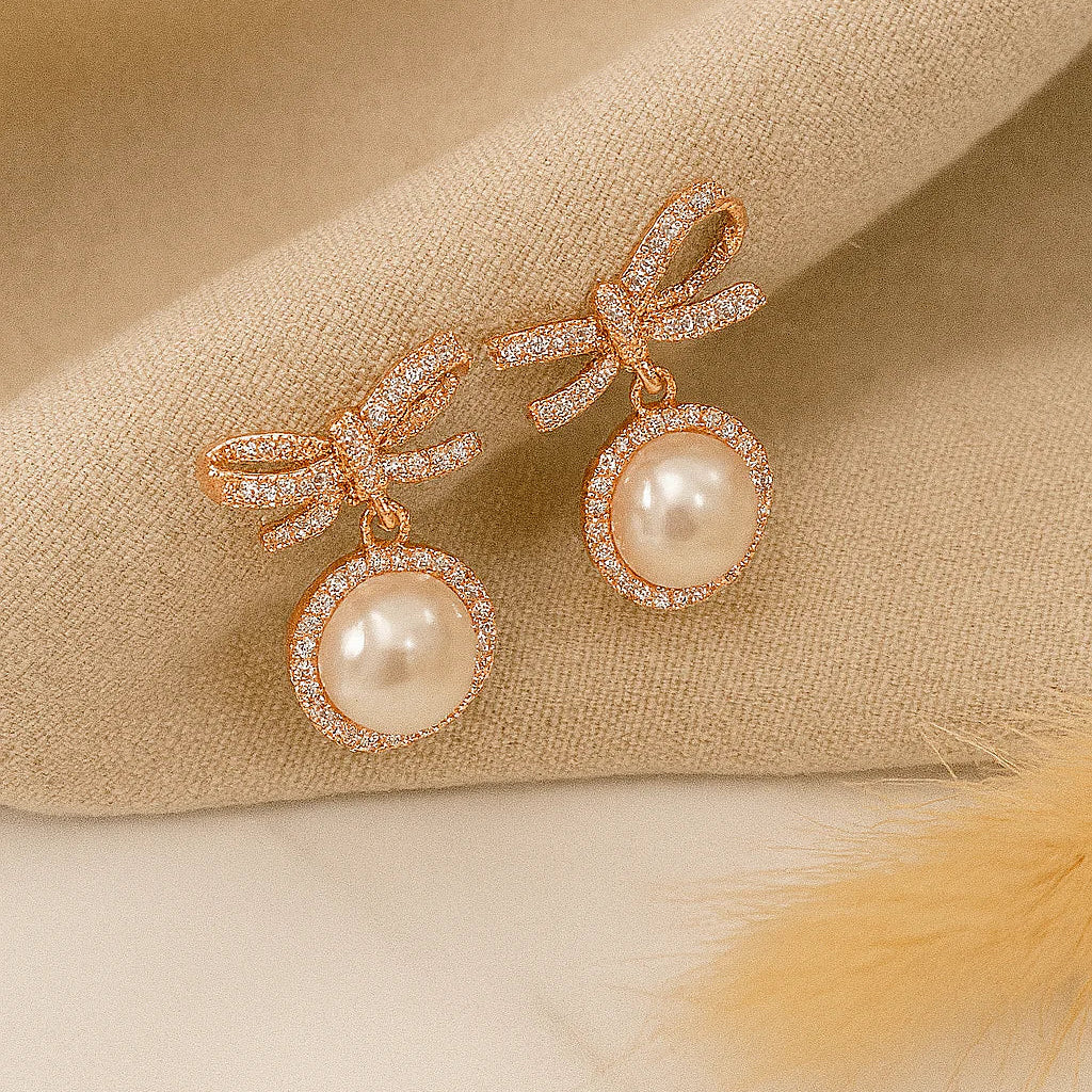 Twisted Bow With Rose Gold Touch Earrings